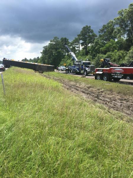 Semi was towing an oversize load when its coupling device snapped. 